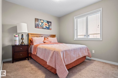 Carpeted bedroom featuring baseboards - 5734 175A Avenue, Edmonton, AB - Indoor Photo Showing Bedroom