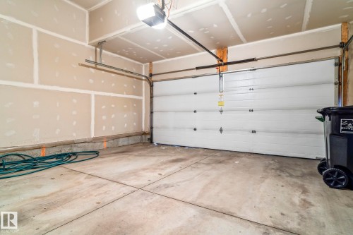 Garage featuring a garage door opener - 5734 175A Avenue, Edmonton, AB - Indoor Photo Showing Garage