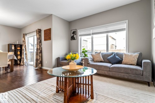 Living room featuring hardwood / wood-style floors and baseboards - 5734 175A Avenue, Edmonton, AB - Indoor Photo Showing Living Room