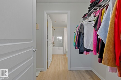 Spacious closet featuring light wood-style floors - 314 530 Hooke Road, Edmonton, AB - Indoor With Storage