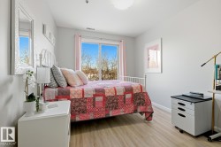 Bedroom featuring light wood-style flooring and baseboards - 