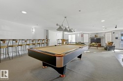 Recreation room with recessed lighting and pool table - 