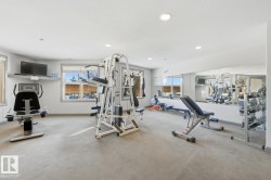 Exercise room featuring recessed lighting and a textured ceiling - 