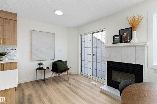 63 1033 Youville Drive W, Edmonton, AB - Indoor Photo Showing Living Room With Fireplace