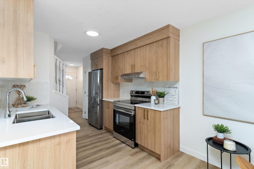 63 1033 Youville Drive W, Edmonton, AB - Indoor Photo Showing Kitchen With Double Sink