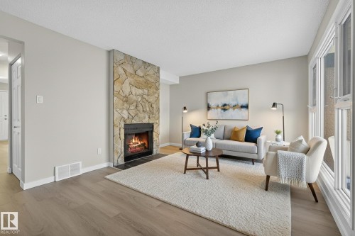 3205 142 Avenue, Edmonton, AB - Indoor Photo Showing Living Room With Fireplace