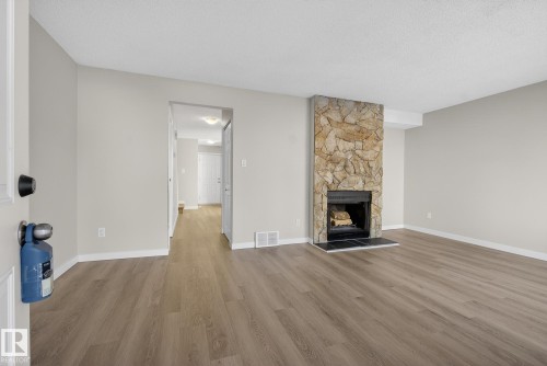 3205 142 Avenue, Edmonton, AB - Indoor Photo Showing Living Room With Fireplace
