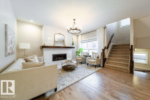 4374 Crabapple Crescent, Edmonton, AB - Indoor Photo Showing Living Room With Fireplace