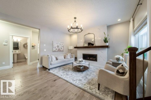 4374 Crabapple Crescent, Edmonton, AB - Indoor Photo Showing Living Room With Fireplace