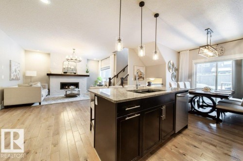 4374 Crabapple Crescent, Edmonton, AB - Indoor Photo Showing Kitchen With Fireplace With Double Sink With Upgraded Kitchen