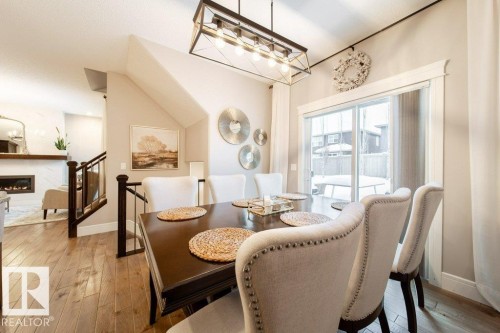 4374 Crabapple Crescent, Edmonton, AB - Indoor Photo Showing Dining Room With Fireplace