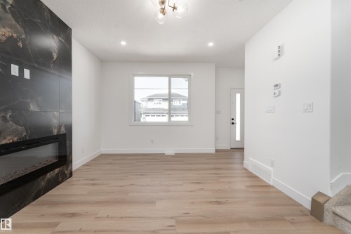 3117 Magpie Way, Edmonton, AB - Indoor Photo Showing Other Room With Fireplace