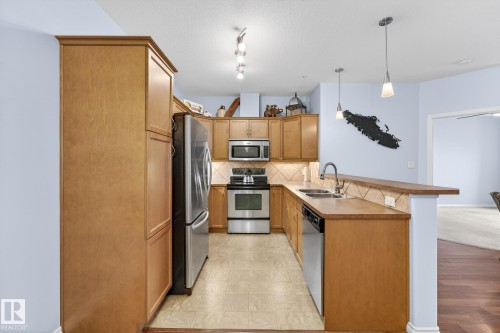 230 2503 Hanna Crescent, Edmonton, AB - Indoor Photo Showing Kitchen With Stainless Steel Kitchen With Double Sink