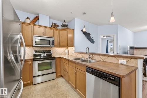 230 2503 Hanna Crescent, Edmonton, AB - Indoor Photo Showing Kitchen With Stainless Steel Kitchen With Double Sink