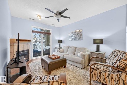 230 2503 Hanna Crescent, Edmonton, AB - Indoor Photo Showing Living Room With Fireplace