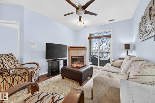 230 2503 Hanna Crescent, Edmonton, AB - Indoor Photo Showing Living Room With Fireplace
