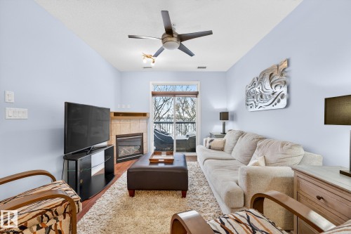 230 2503 Hanna Crescent, Edmonton, AB - Indoor Photo Showing Living Room With Fireplace
