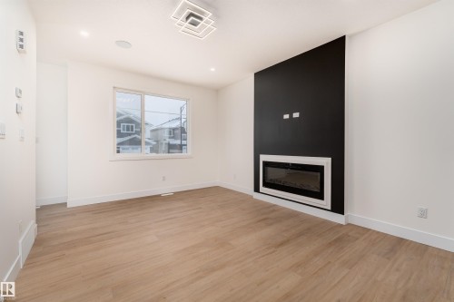 3103 Magpie Way, Edmonton, AB - Indoor Photo Showing Living Room With Fireplace