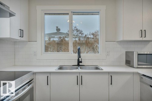 44 Athapaskan Drive, Leduc, AB - Indoor Photo Showing Kitchen With Double Sink