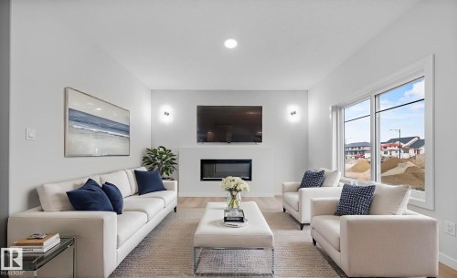 6385 King Wynd, Edmonton, AB - Indoor Photo Showing Living Room With Fireplace