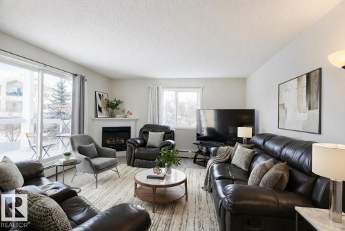 #226 10511 42 Avenue, Edmonton, AB - Indoor Photo Showing Living Room With Fireplace