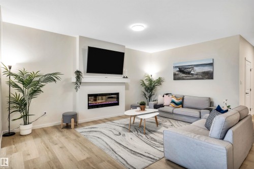 4930 Kinney Road, Edmonton, AB - Indoor Photo Showing Living Room With Fireplace