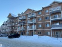 Snow covered building featuring a view of apartment building / complex - 321 4304 139 Avenue, Edmonton, AB  - Outdoor With Balcony With Facade 