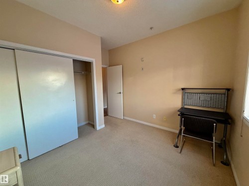 Bedroom with carpet floors, a closet, and a textured ceiling - 321 4304 139 Avenue, Edmonton, AB - Indoor Photo Showing Other Room