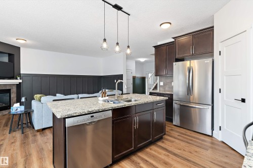 16 Sutherland Street, Leduc, AB - Indoor Photo Showing Kitchen With Double Sink With Upgraded Kitchen