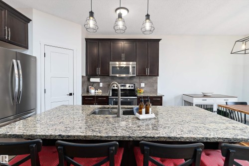 16 Sutherland Street, Leduc, AB - Indoor Photo Showing Kitchen With Double Sink With Upgraded Kitchen
