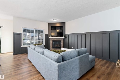 16 Sutherland Street, Leduc, AB - Indoor Photo Showing Living Room With Fireplace