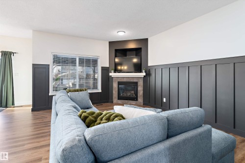 16 Sutherland Street, Leduc, AB - Indoor Photo Showing Living Room With Fireplace