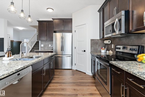 16 Sutherland Street, Leduc, AB - Indoor Photo Showing Kitchen With Double Sink With Upgraded Kitchen