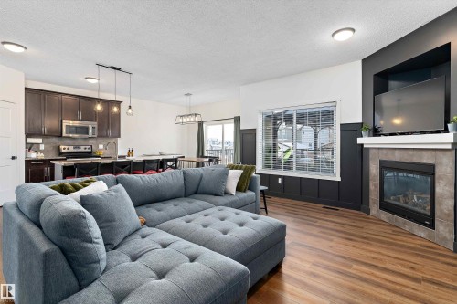 16 Sutherland Street, Leduc, AB - Indoor Photo Showing Living Room With Fireplace
