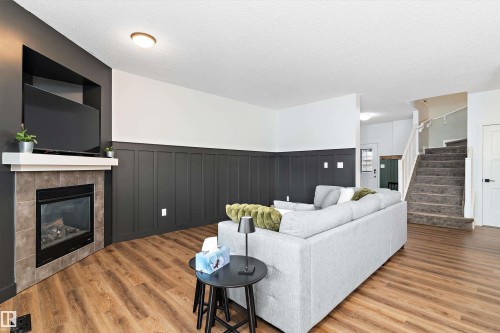 16 Sutherland Street, Leduc, AB - Indoor Photo Showing Living Room With Fireplace