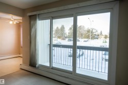 Entryway with baseboard heating and carpet floors - 