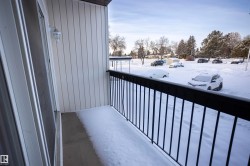 View of snow covered back of property - 
