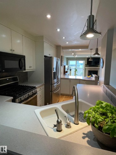 15114 45 Avenue, Edmonton, AB - Indoor Photo Showing Kitchen With Double Sink