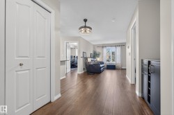Corridor featuring baseboards and dark wood-type flooring - 