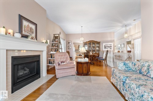 1548 54 Street, Edmonton, AB - Indoor Photo Showing Living Room With Fireplace