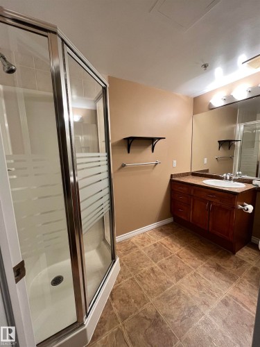 Full bathroom with a shower stall and vanity - 405 10319 111 Street, Edmonton, AB - Indoor Photo Showing Bathroom