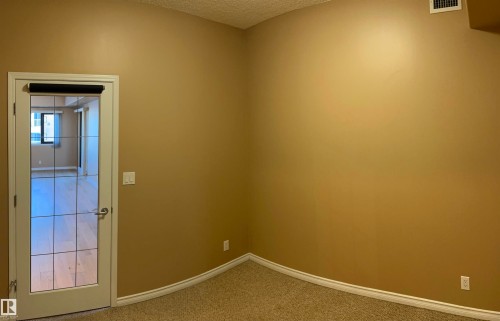Second bedroom/den, featuring a french door - 405 10319 111 Street, Edmonton, AB - Indoor Photo Showing Other Room