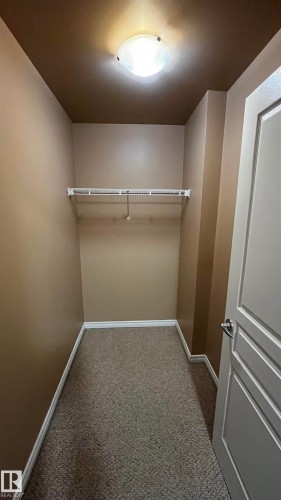 View of spacious closet in the second bedroom/den - 405 10319 111 Street, Edmonton, AB - Indoor With Storage