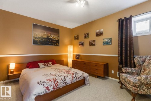Carpeted bedroom with baseboards - 6508 109 Avenue, Edmonton, AB - Indoor Photo Showing Bedroom