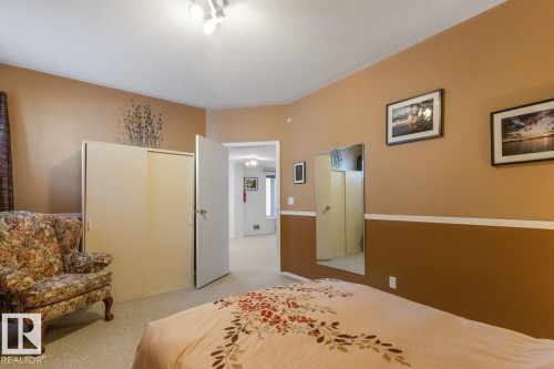 Bedroom featuring light colored carpet and a textured ceiling - 6508 109 Avenue, Edmonton, AB - Indoor Photo Showing Bedroom