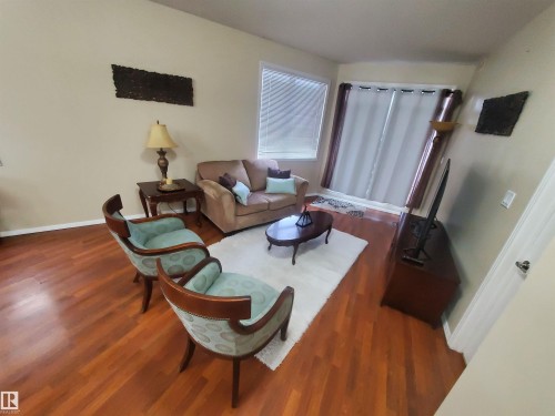 100 9940 Sherridon Drive, Fort Saskatchewan, AB - Indoor Photo Showing Living Room