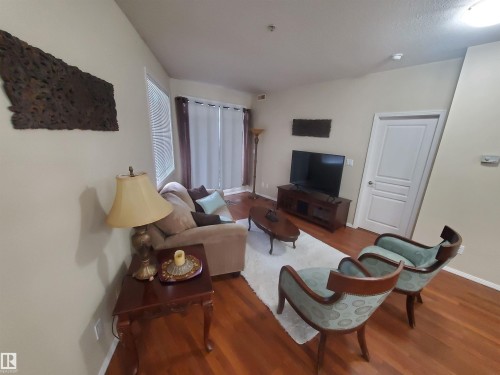 100 9940 Sherridon Drive, Fort Saskatchewan, AB - Indoor Photo Showing Living Room