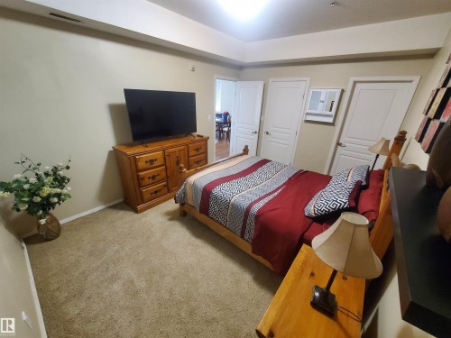 100 9940 Sherridon Drive, Fort Saskatchewan, AB - Indoor Photo Showing Bedroom