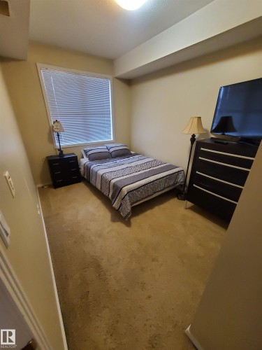 100 9940 Sherridon Drive, Fort Saskatchewan, AB - Indoor Photo Showing Bedroom