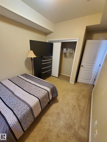 100 9940 Sherridon Drive, Fort Saskatchewan, AB - Indoor Photo Showing Bedroom
